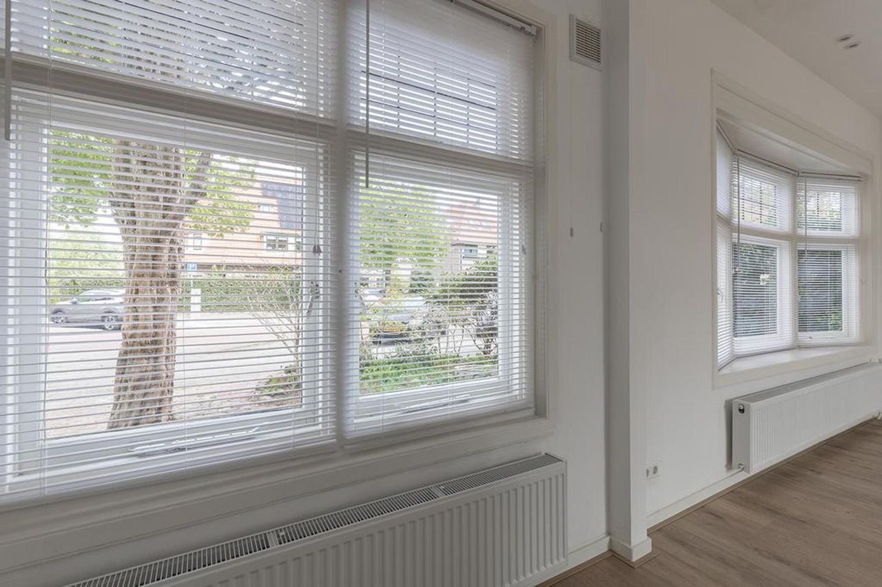 Hoekwoning met 20 meter diepe tuin - Afbeelding 10