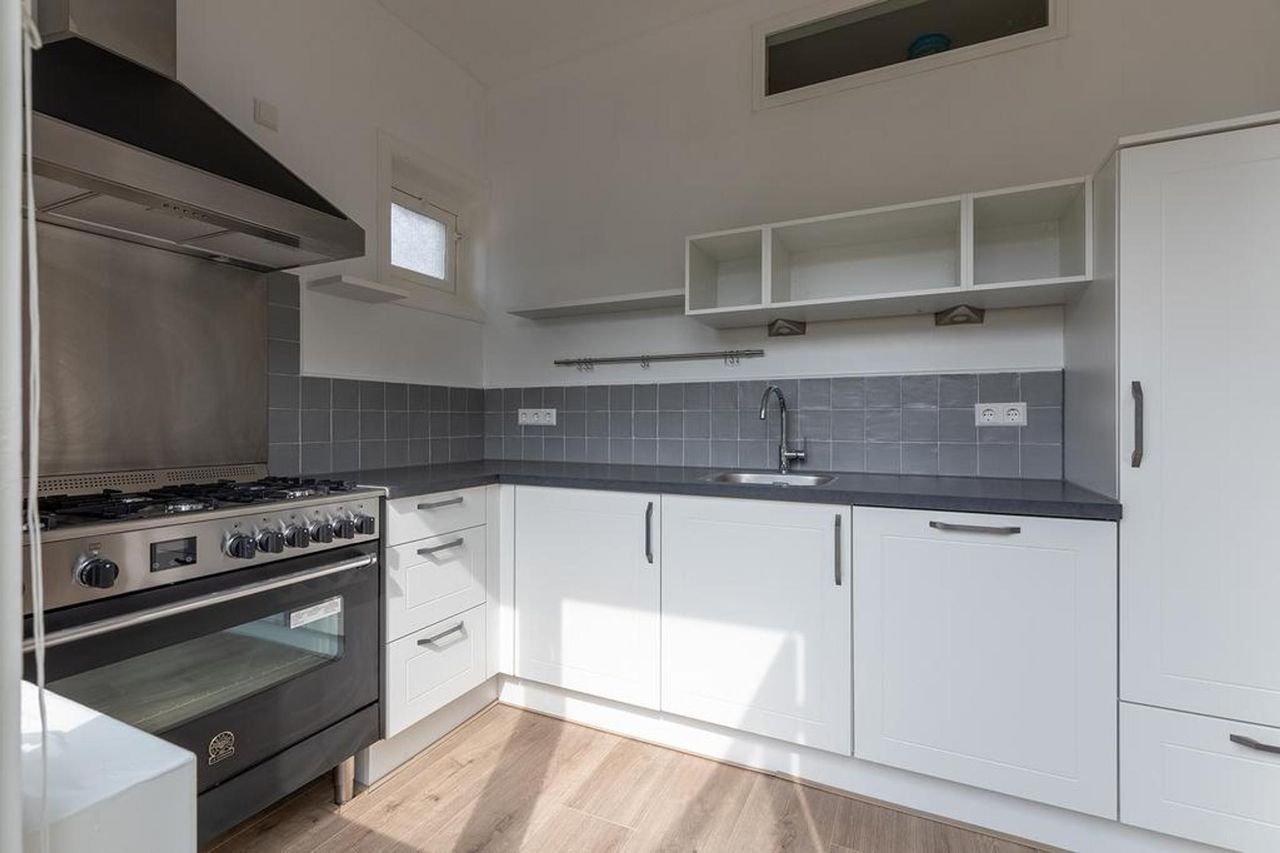 Hoekwoning met 20 meter diepe tuin - Afbeelding 7