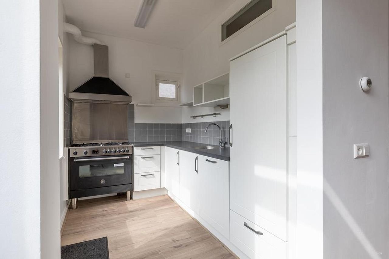 Hoekwoning met 20 meter diepe tuin - Afbeelding 6