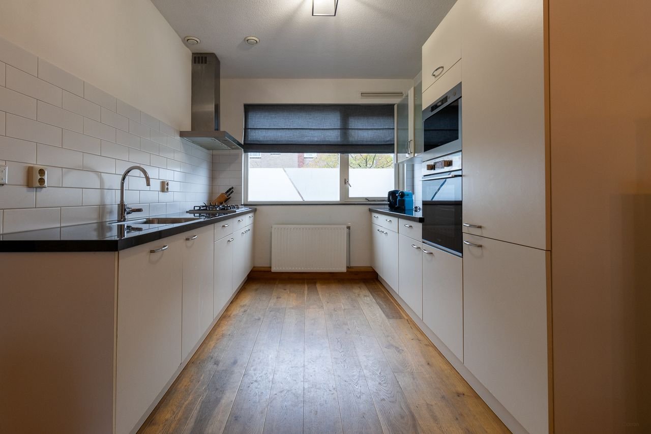 Ruime gezinswoning met tuin in Schiebroek - Afbeelding 3