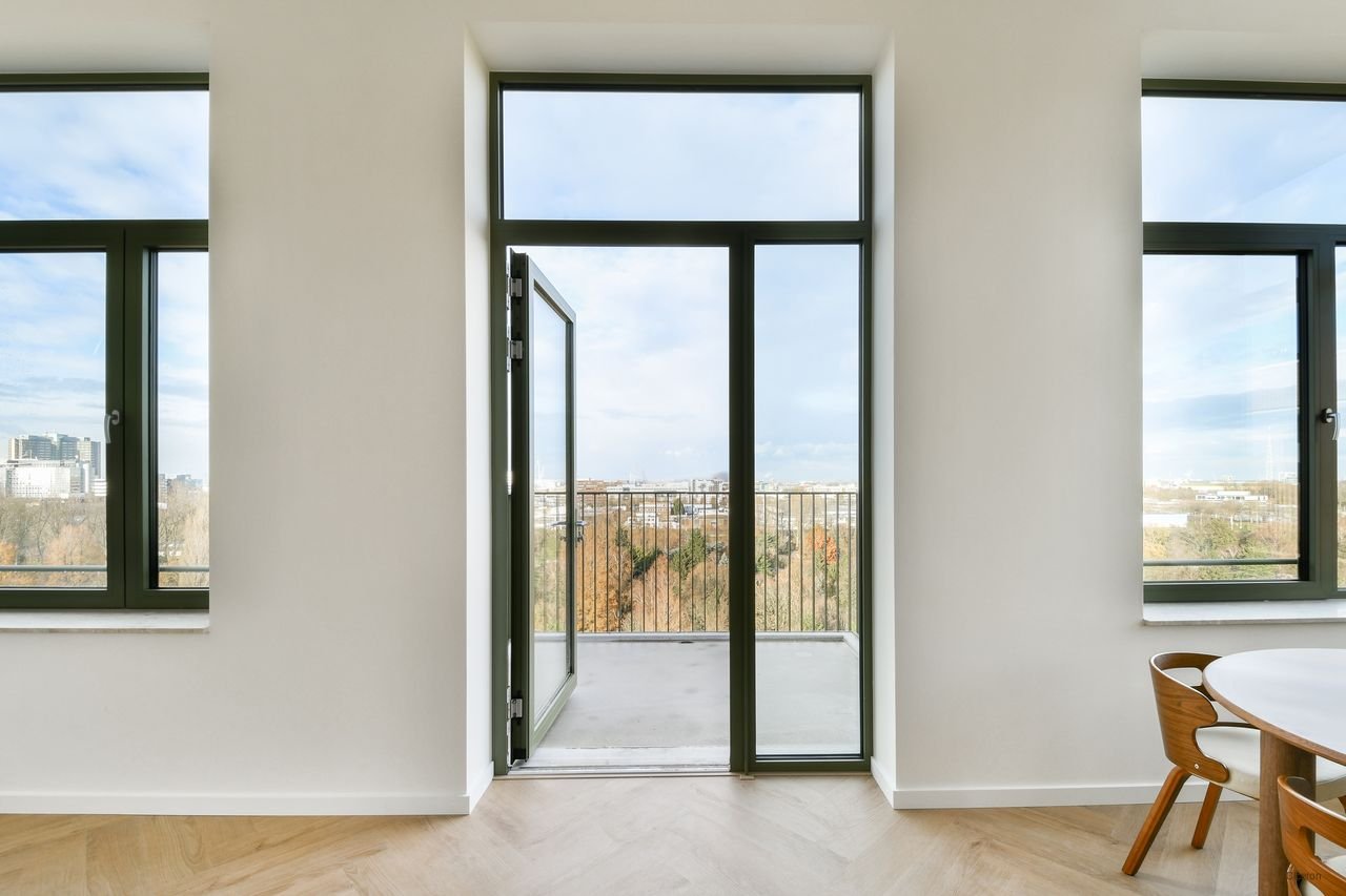 Licht penthouse met uitzicht in Westerpark - Afbeelding 7