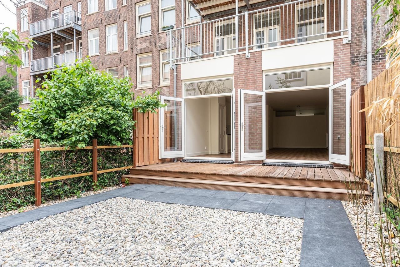 Benedenhuis met zonnige tuin aan de Nassaukade - Afbeelding 1