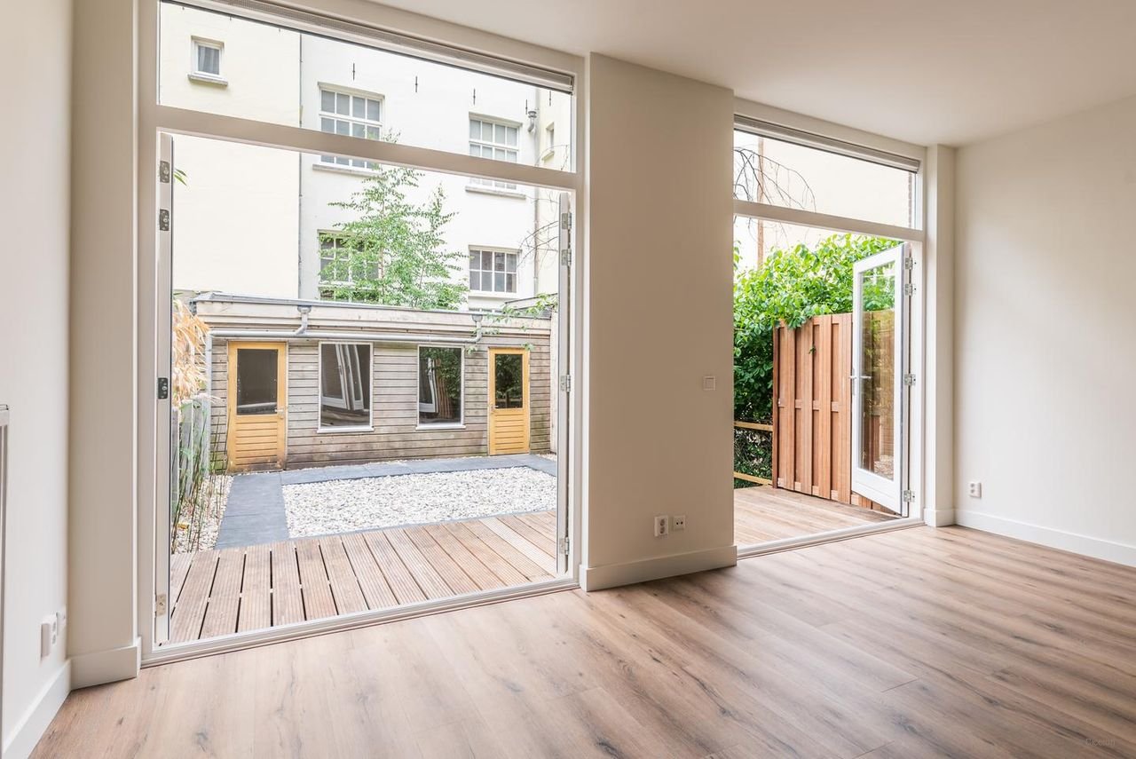 Benedenhuis met zonnige tuin aan de Nassaukade - Afbeelding 6