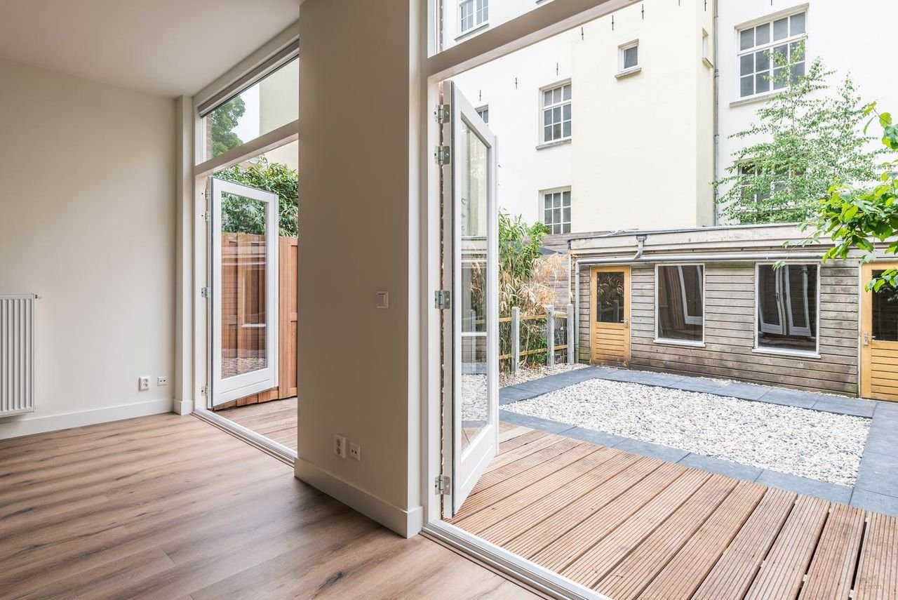 Benedenhuis met zonnige tuin aan de Nassaukade - Afbeelding 11