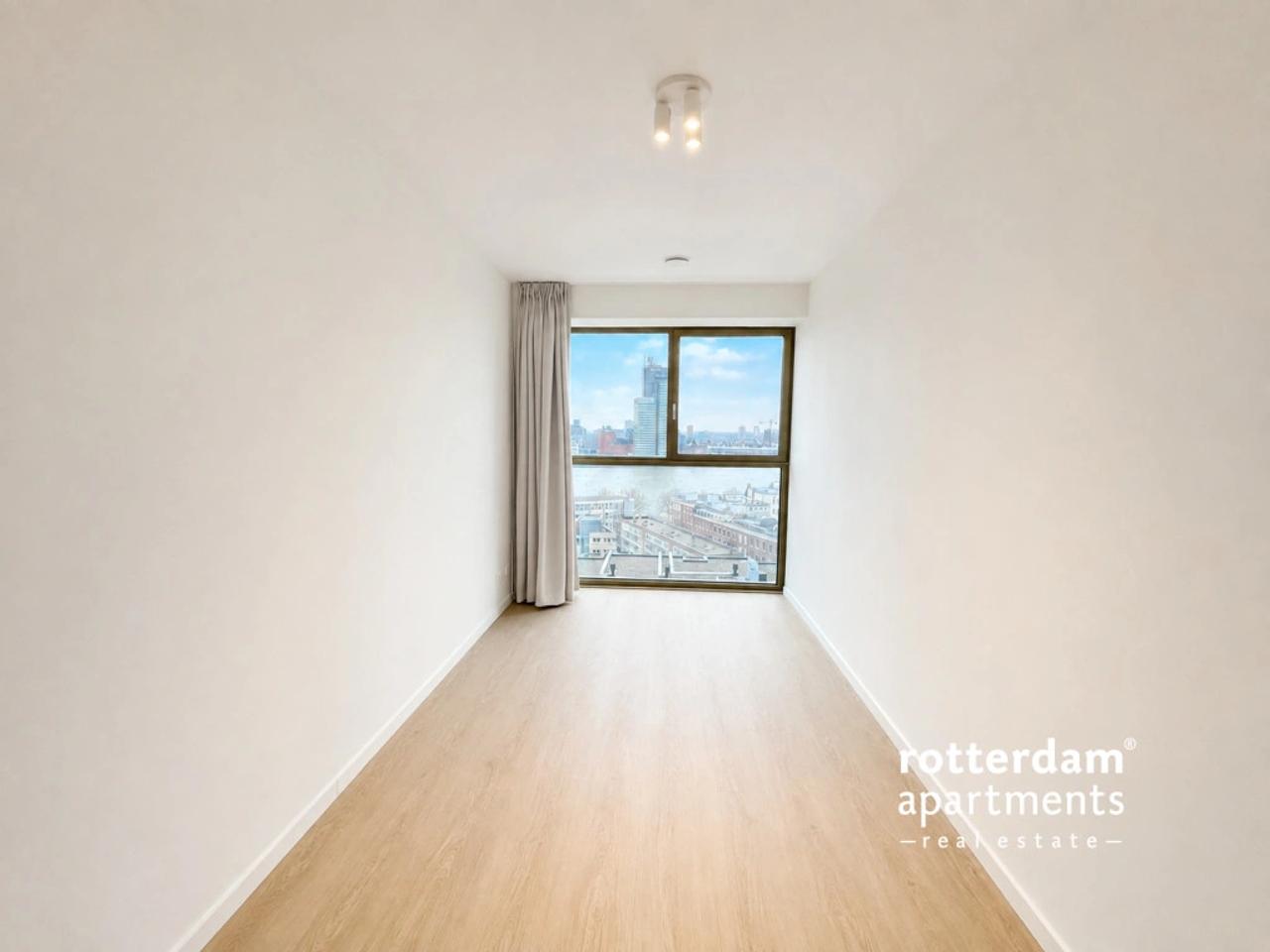 Skylinezicht vanuit je 3-slaapkamerappartement - Afbeelding 6