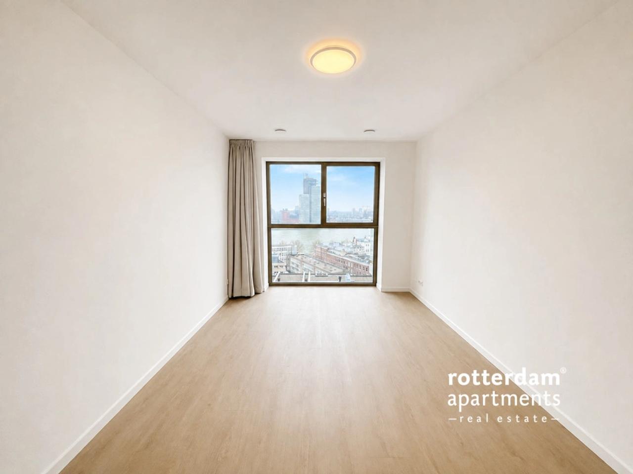 Skylinezicht vanuit je 3-slaapkamerappartement - Afbeelding 7