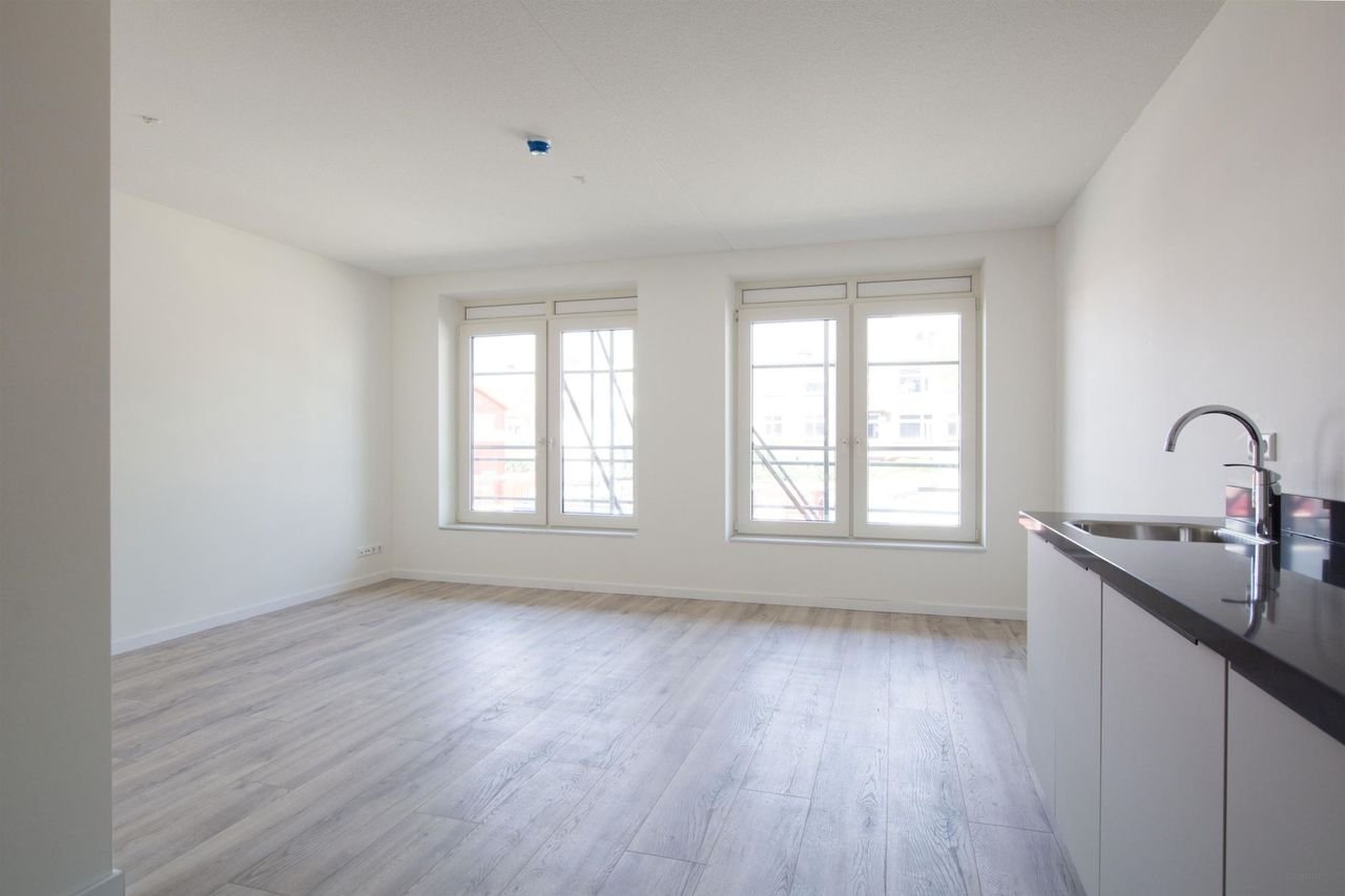 Modern appartement met gezamenlijke tuin - Afbeelding 1
