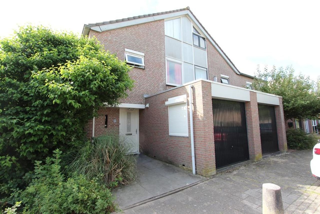 Dwarskapwoning met garage in Muziekwijk - Afbeelding 1
