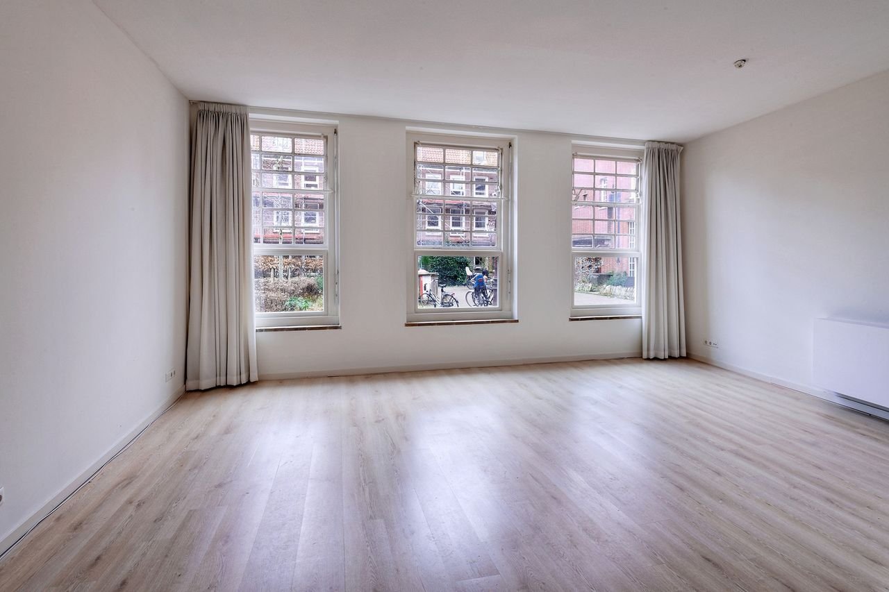 Benedenwoning in Oost met enorme tuin - Afbeelding 10