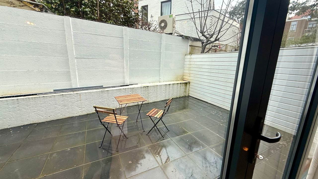 Modern benedenhuis met tuin aan de Regentesselaan - Afbeelding 9