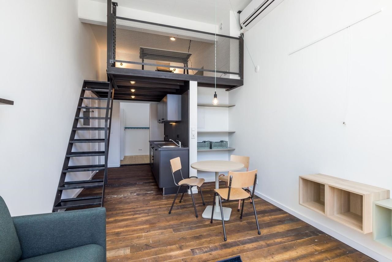 Industrieel wonen in oud schoolgebouw - Afbeelding 1