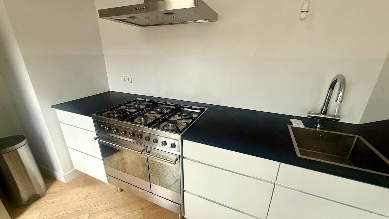 Licht hoekappartement met open haard - Afbeelding 9