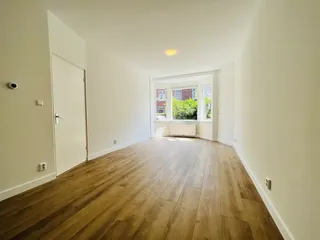 Begane grond appartement met eigen tuin