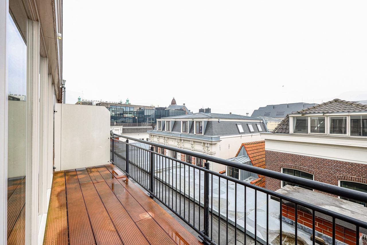 Licht 3-kamer appartement met balkon bij de Dam - Afbeelding 9
