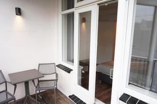 Licht 2-kamerappartement met balkon in de Jordaan - Afbeelding 14