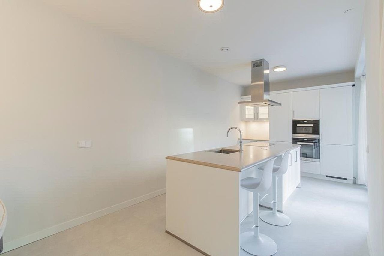 Licht appartement van 145 m² met kookeiland - Afbeelding 10