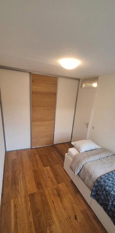 Tweekapper met garage en tuin in Reeshof - Afbeelding 23