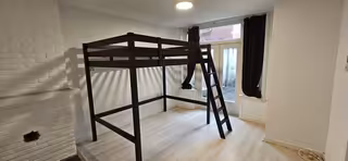 Bright room with loft bed and garden