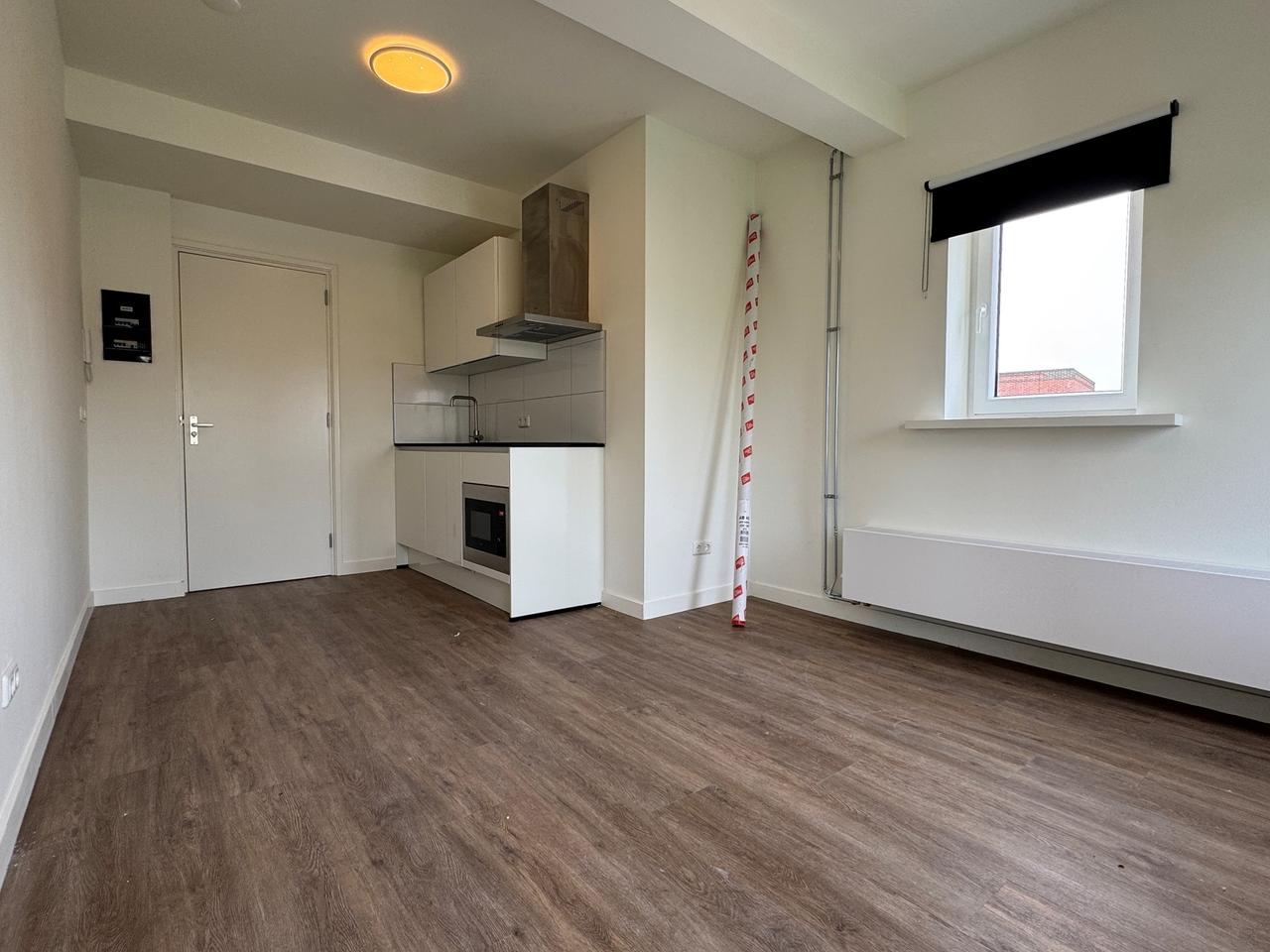 Bright room with kitchen in Helpman - Image 5
