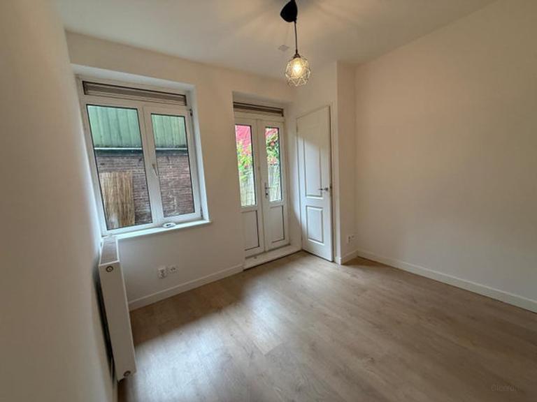2-slaapkamer appartement met tuin - Afbeelding 2