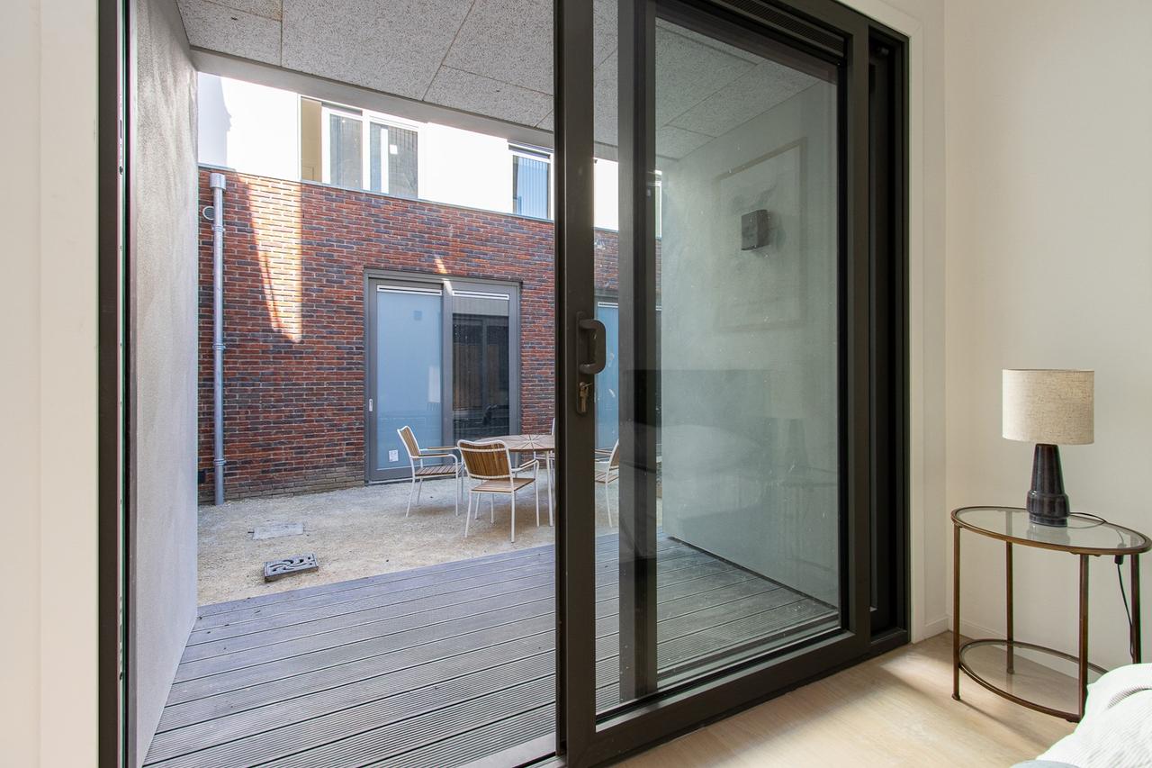 Lichte studio met loft en tuin in centrum - Afbeelding 8