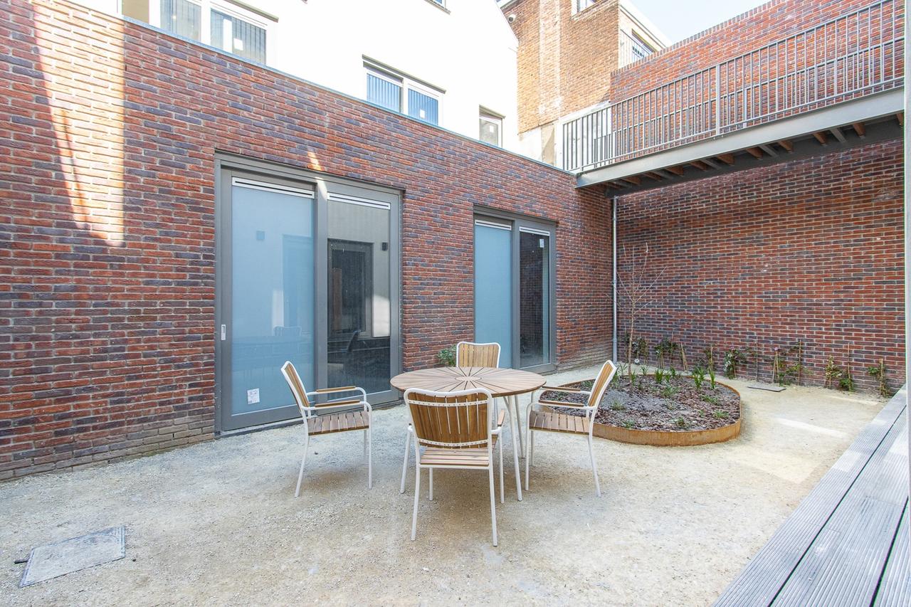 Lichte studio met loft en tuin in centrum - Afbeelding 9