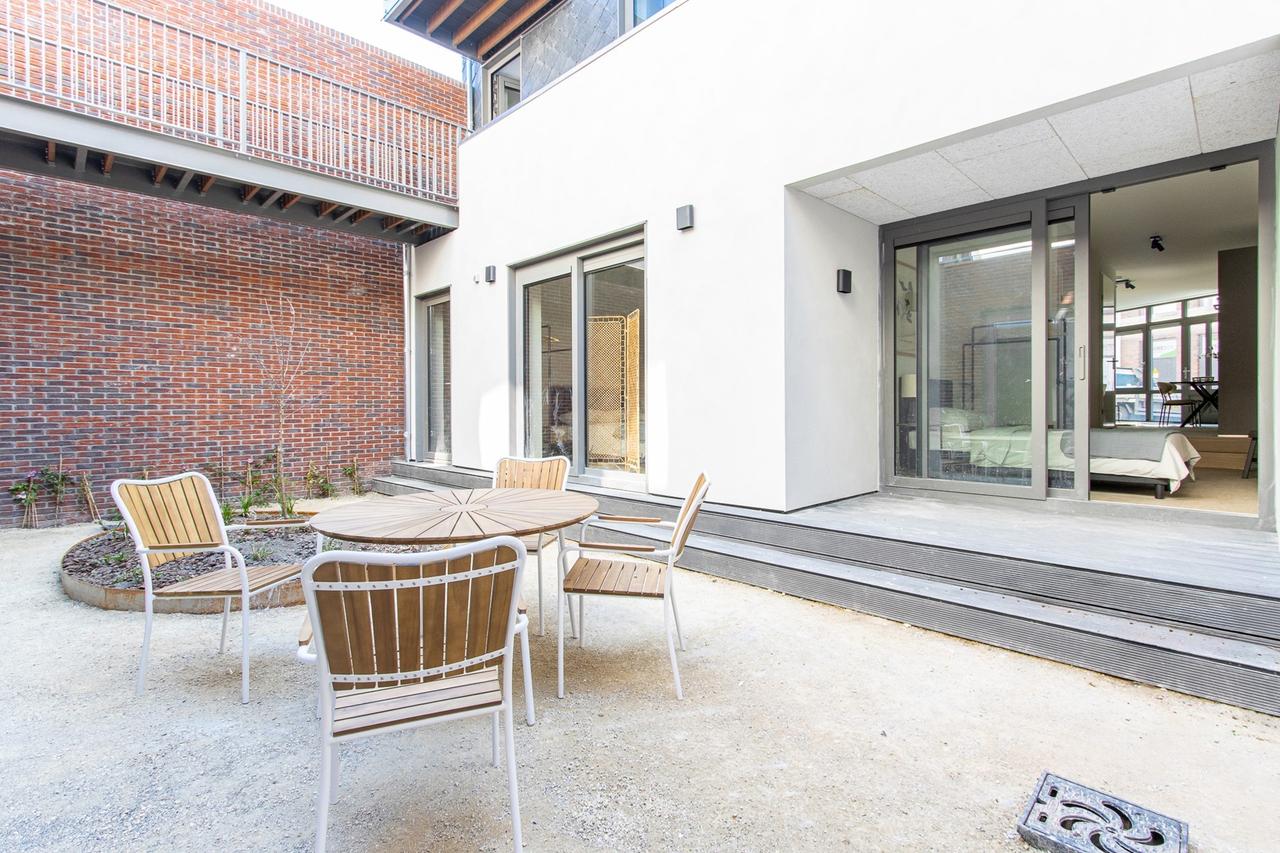 Lichte studio met loft en tuin in centrum - Afbeelding 10