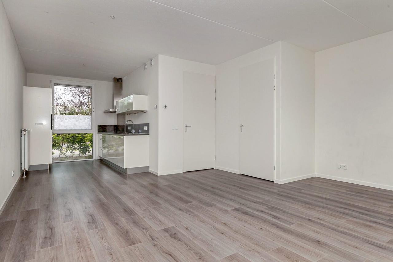 Tussenwoning met tuin en parkeerplek - Afbeelding 8