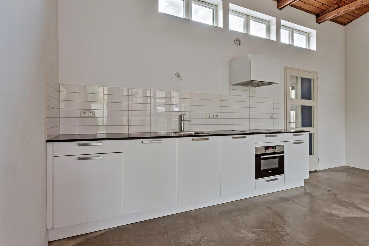 Licht 2-kamerappartement met grote tuin - Afbeelding 4