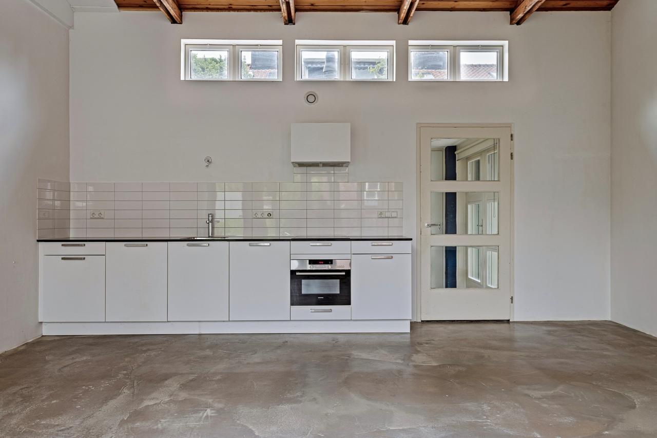 Licht 2-kamerappartement met grote tuin - Afbeelding 6