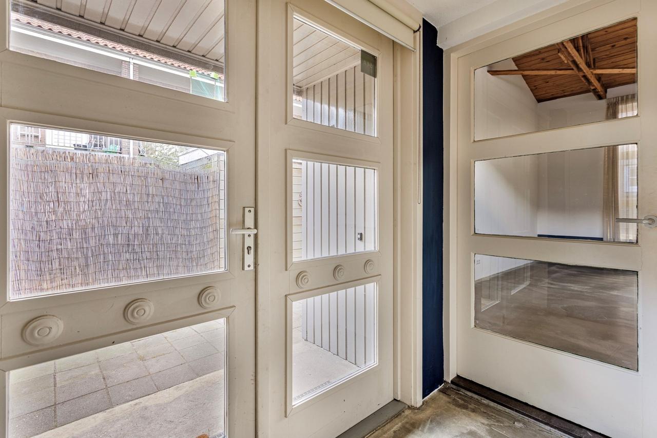 Licht 2-kamerappartement met grote tuin - Afbeelding 7