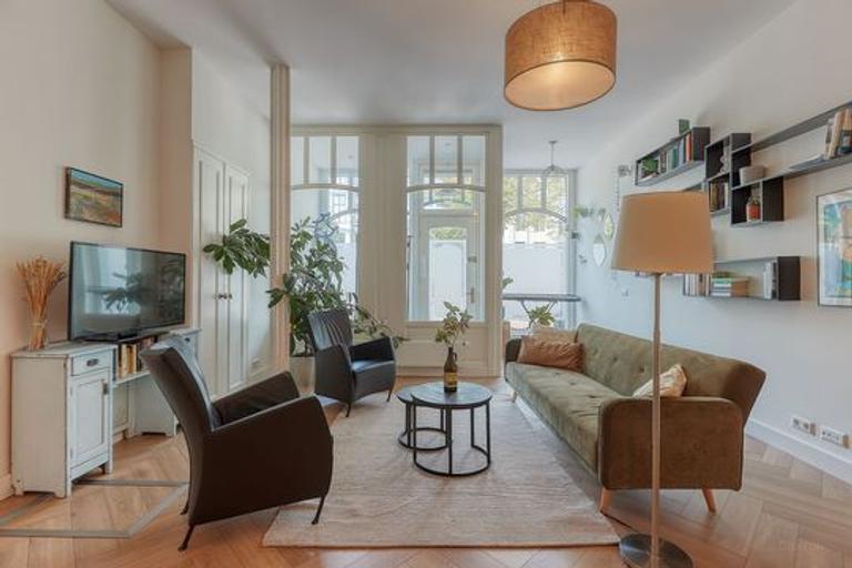 Gemeubileerde benedenwoning met tuin - Afbeelding 3