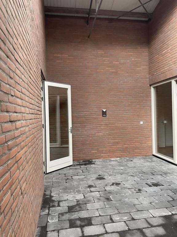 Gasloos appartement met patio in Maaswaard - Afbeelding 11