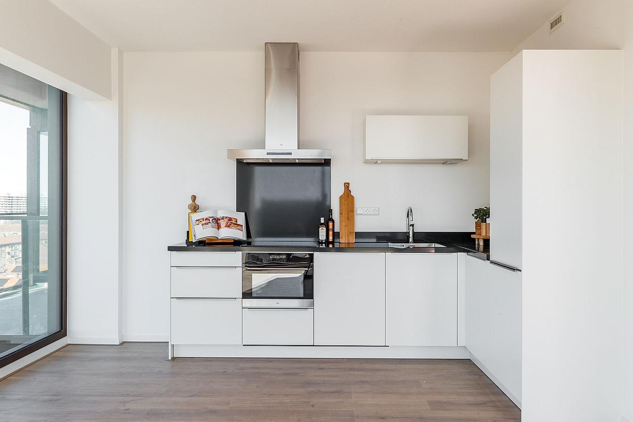 Skylinezicht vanuit een appartement van 92 m² - Afbeelding 4