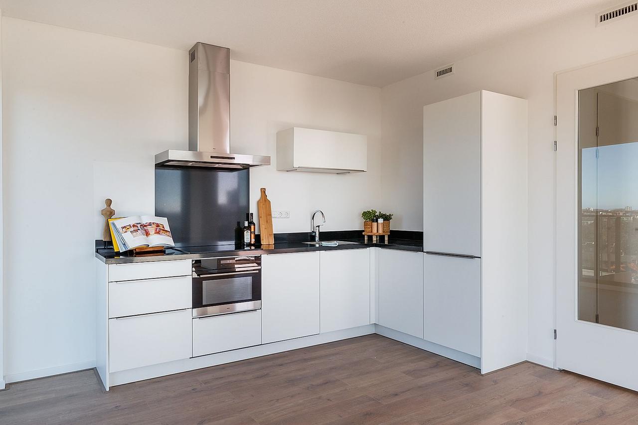 Skylinezicht vanuit een appartement van 92 m² - Afbeelding 5