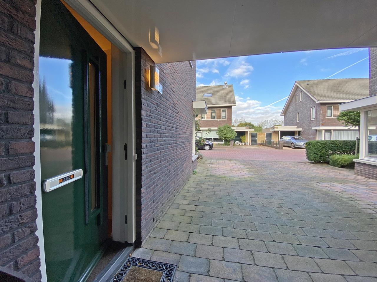 185 m² woonruimte met zonnige tuin en garage - Afbeelding 9