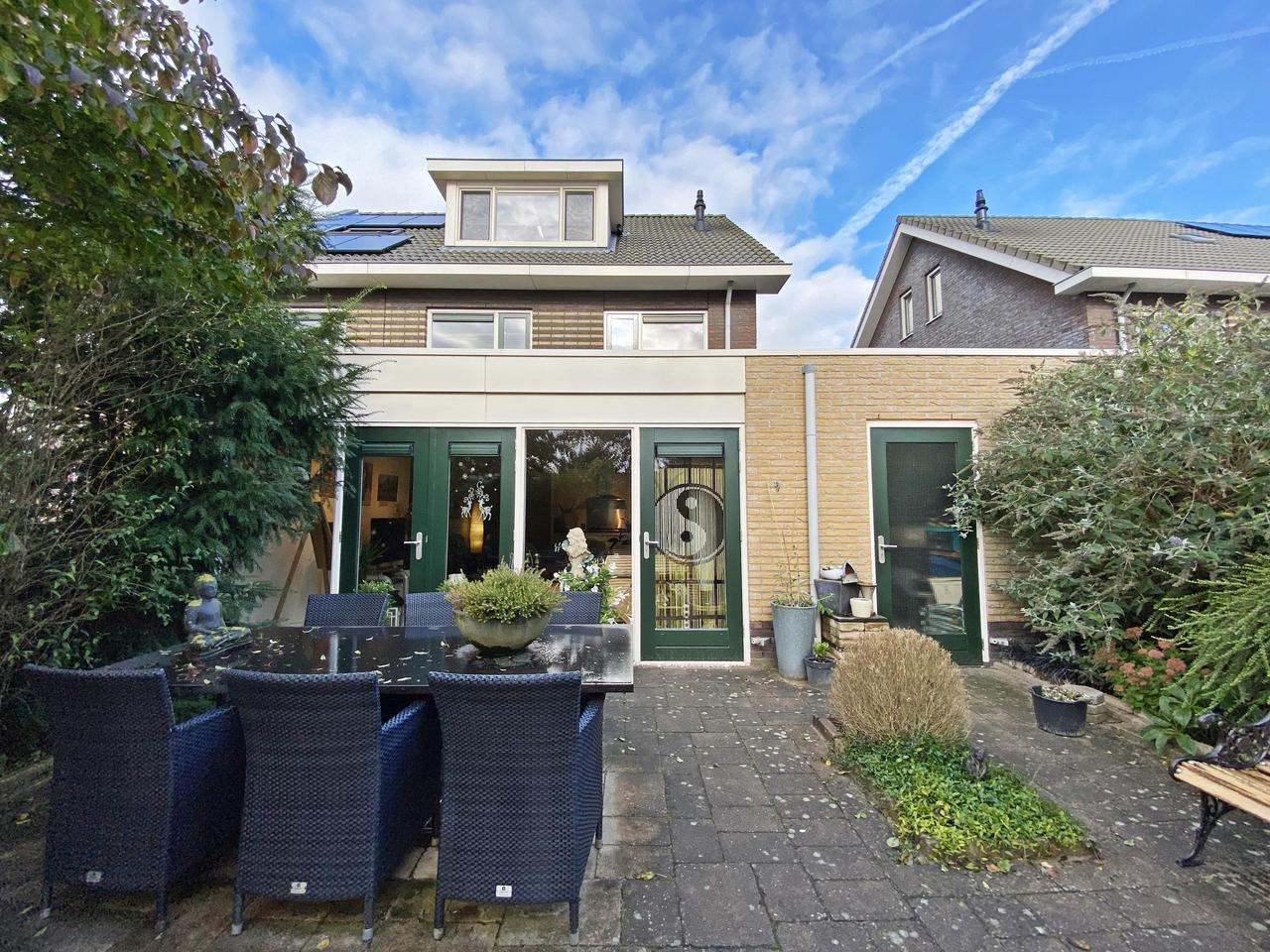 185 m² woonruimte met zonnige tuin en garage - Afbeelding 18