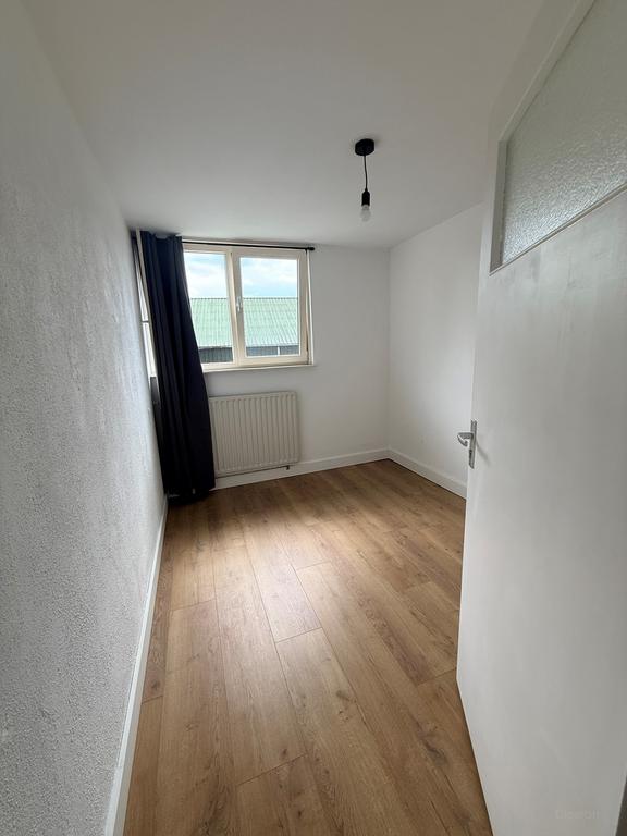 Rijtjeshuis met 4 slaapkamers en tuin in De Schutskamp - Afbeelding 12