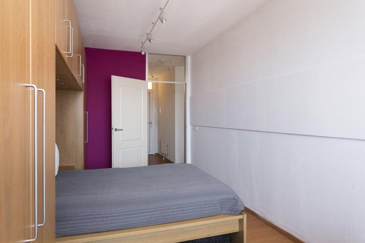 Furnished 1-Bedroom Apartment with Green Views - Image 11