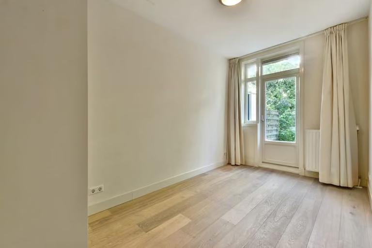 Furnished 2-Bedroom Apartment with Garden - Image 9